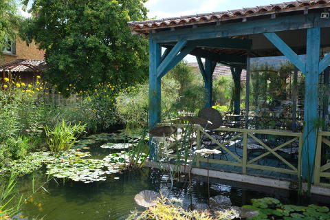 Cafe and shop on the edge of the water garden of Carsac Aillac