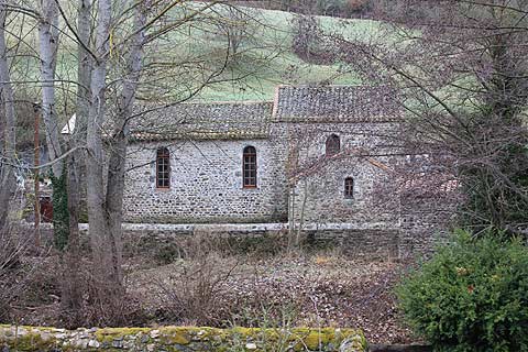 Church surrounded by trees in Blesle village