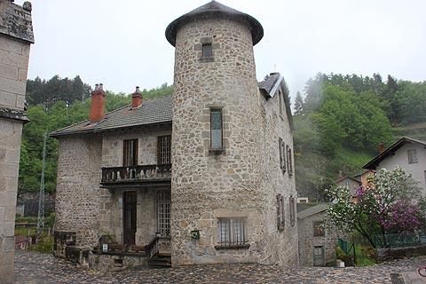Ancient stone house and tower in Olliergues