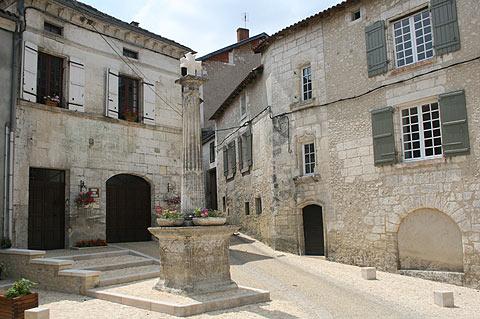 Fountain in stone in centre of Bourdeilles