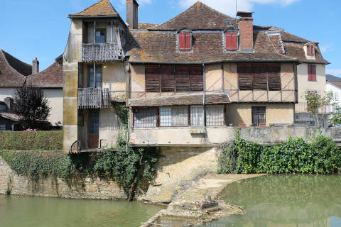 old houses along river in Salies-de-Bearn
