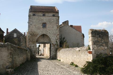 Stone gateway leading to historic centre of Charroux